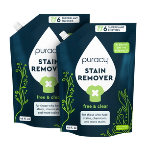 Two 48 fl. oz. pouches of Puracy Laundry Stain Remover with plant-based formula and green/white design.