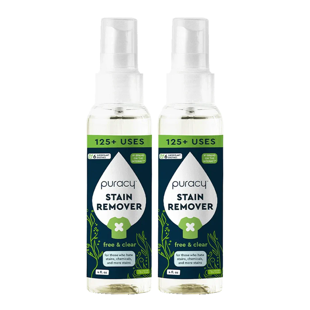 Two bottles of Puracy Laundry Stain Remover with spray tops and green labels.