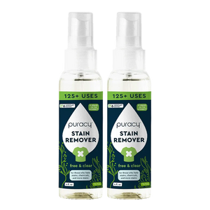 Two bottles of Puracy Laundry Stain Remover with spray tops and green labels.